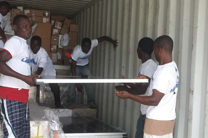 Solar panels being unloaded at Phebe Hospital, Bong County, Liberia